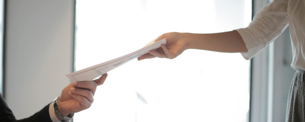 borrower-handing-document-lender-seo